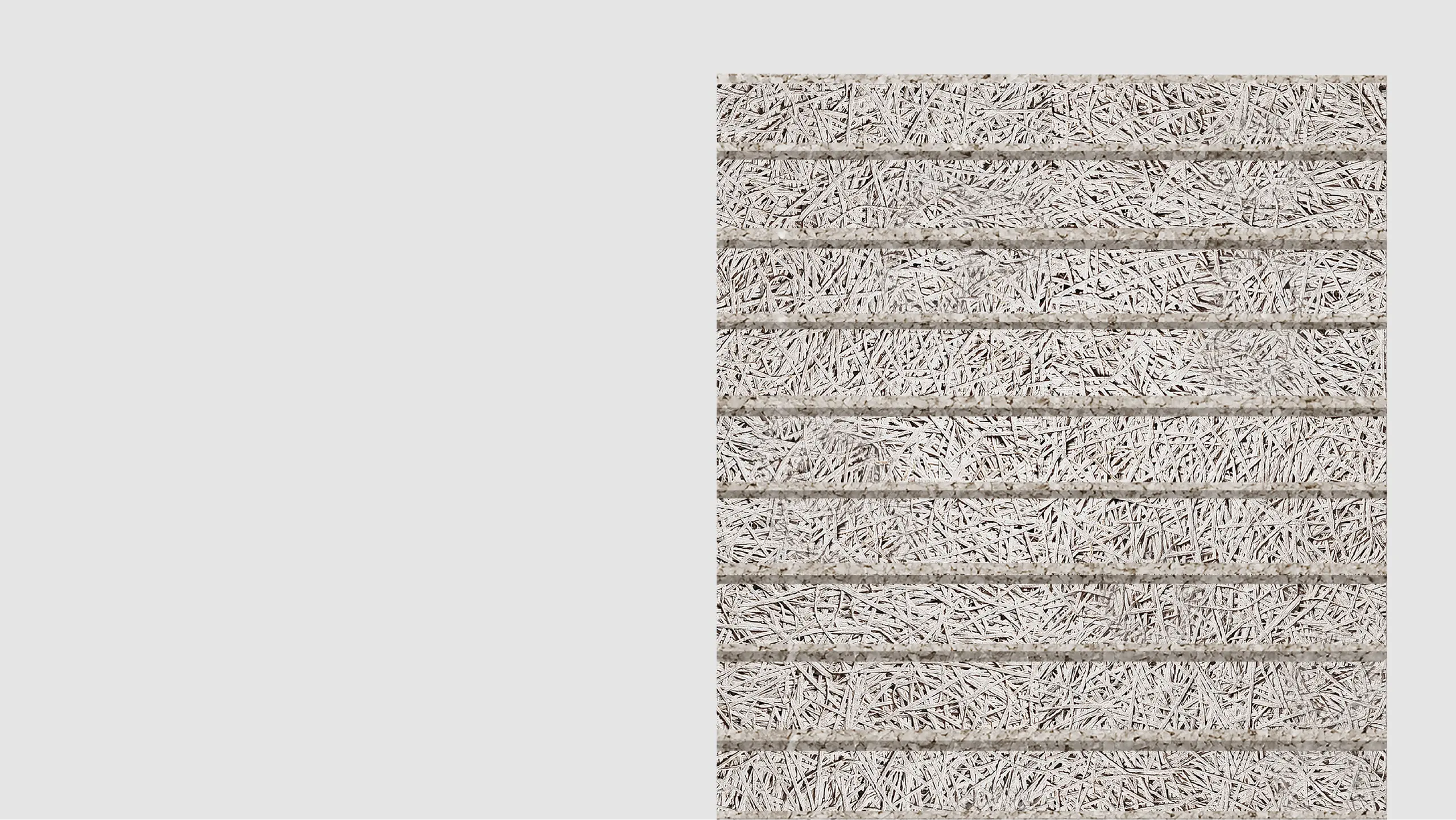 A close-up view of a rectangular panel made of tightly packed, light gray wood wool strands held together in horizontal rows, set against a plain light background.