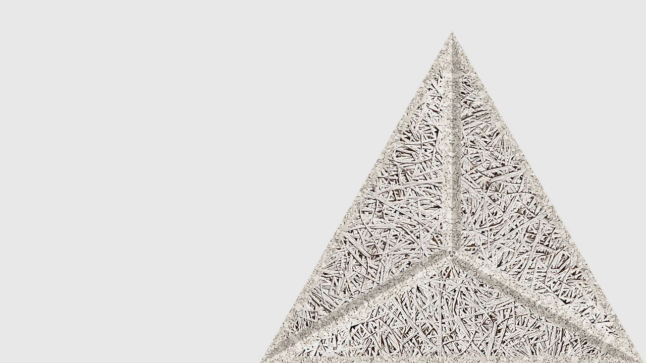 A close-up of a textured, triangular object with three compartments, made of interwoven, straw-like material, against a plain white background.