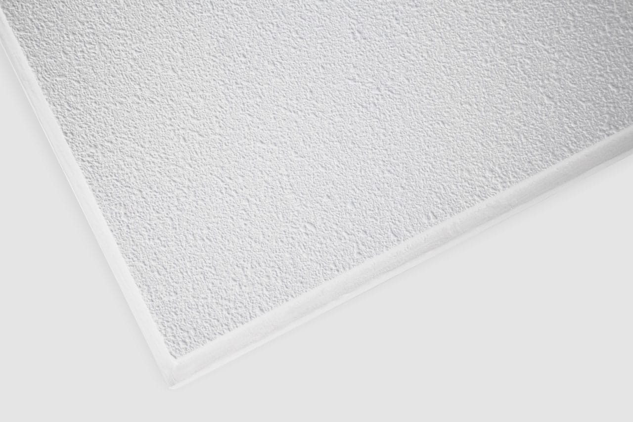 Close-up view of a white textured ceiling tile with a slightly rough surface, shown at an angle against a plain white background.