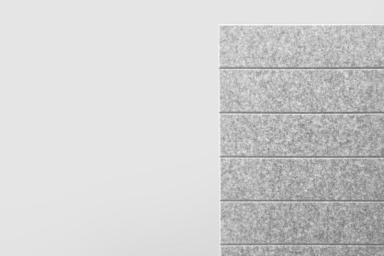 A vertical arrangement of six rectangular, textured gray panels is shown on the right side against a plain light gray background.