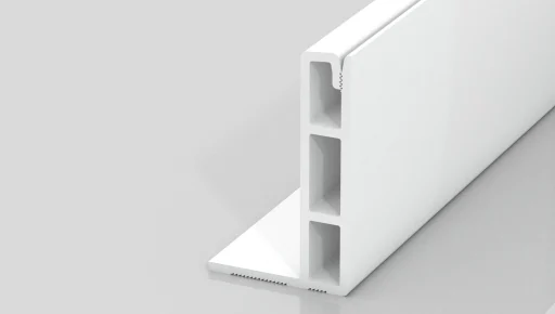 A white, rectangular plastic extrusion piece with three vertical hollow sections and a flat base, standing upright on a light gray reflective surface.