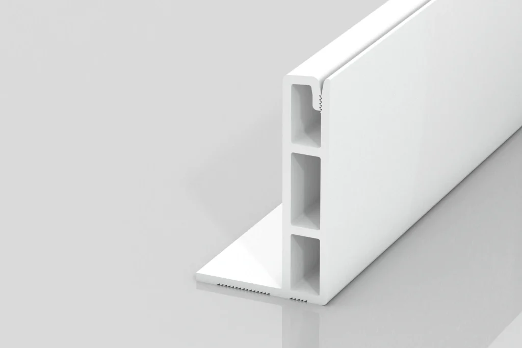 A white, rectangular plastic extrusion piece with three vertical hollow sections and a flat base, standing upright on a light gray reflective surface.