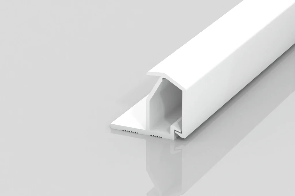 A white, rectangular plastic trim piece with a flat base and grooved inner section, shown on a reflective light gray surface.