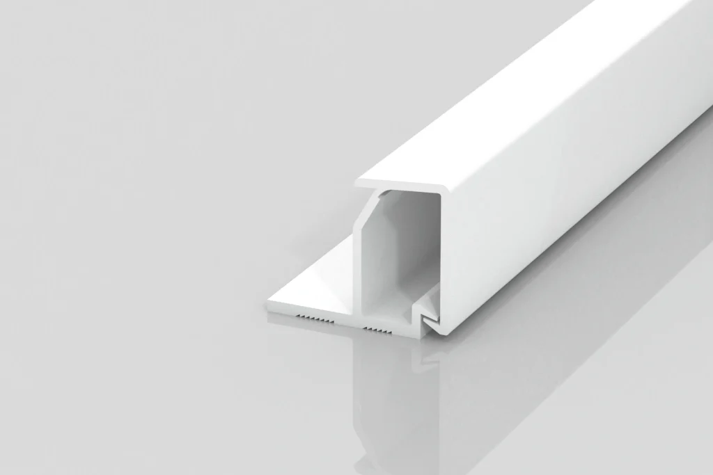 A white, rectangular plastic or metal channel with an open slot and a flat base sits on a glossy, light gray surface, showing a minimal, modern design.
