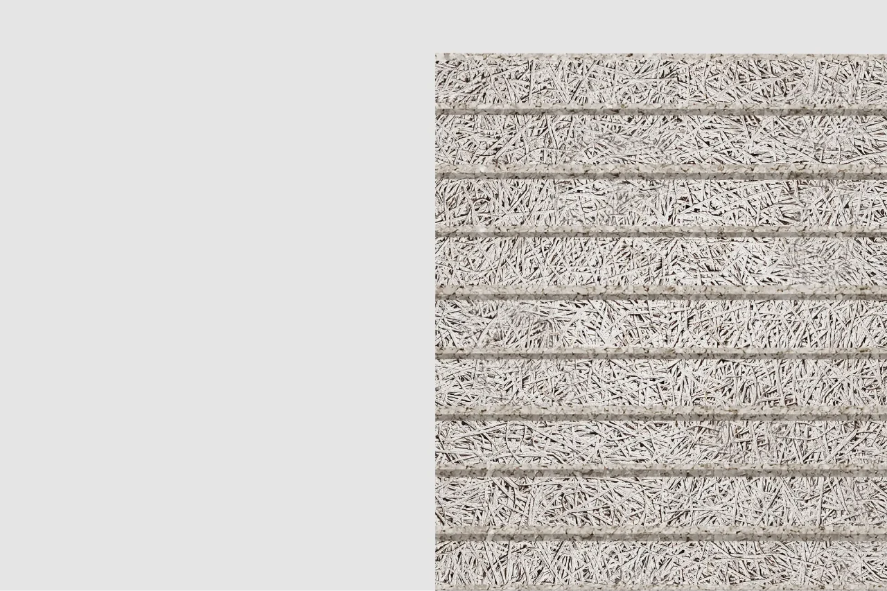 A close-up view of a rectangular panel made of tightly packed, light gray wood wool strands held together in horizontal rows, set against a plain light background.