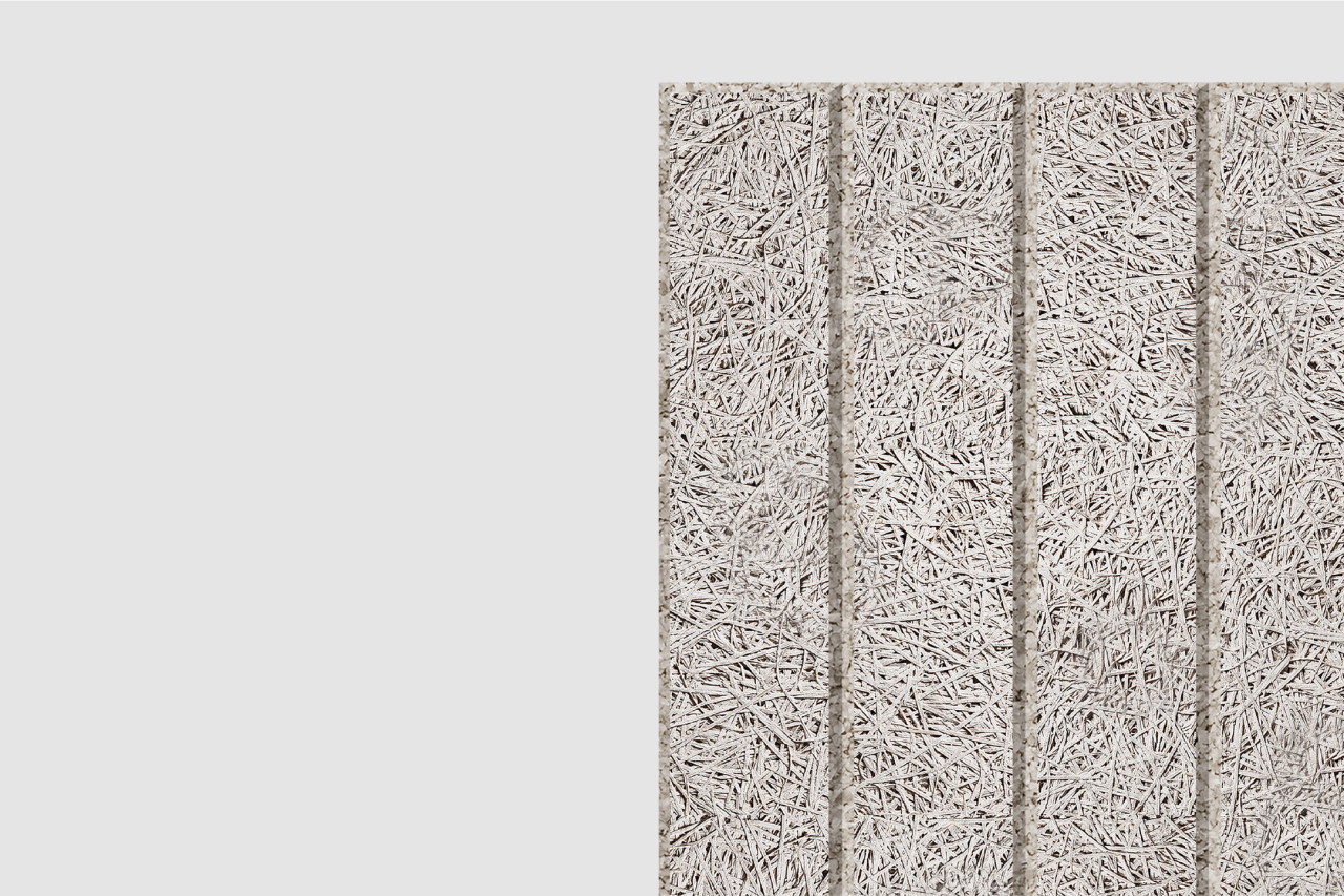 A textured, rectangular surface resembling compressed straw or wood fibers divided into four vertical sections, set against a plain light gray background.